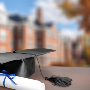 college graduation cap and diploma for undergraduates and grad students from emerson college who are staying in the boston area with maverick suites for 10% off all rentals and bookings