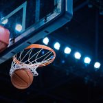 basketball going into hoop during nba playoffs in boston where the celtics are playing in 2025 to defend their title