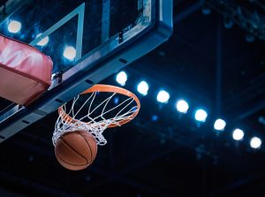 basketball going into hoop during nba playoffs in boston where the celtics are playing in 2025 to defend their title